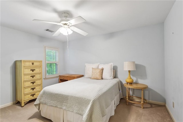 bedroom with light carpet, baseboards, and ceiling fan