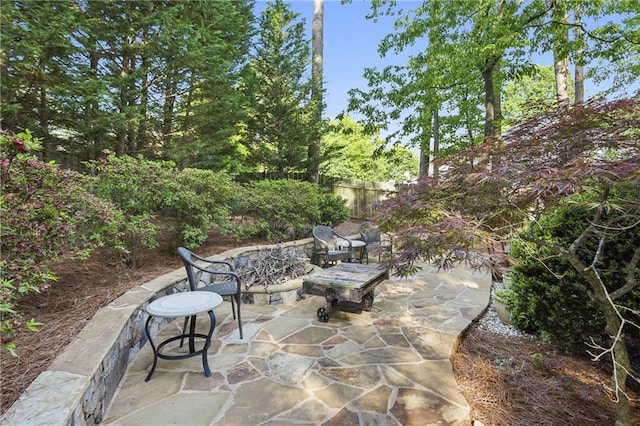 view of patio / terrace featuring fence