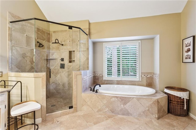bathroom with a bath, a stall shower, and tile patterned flooring