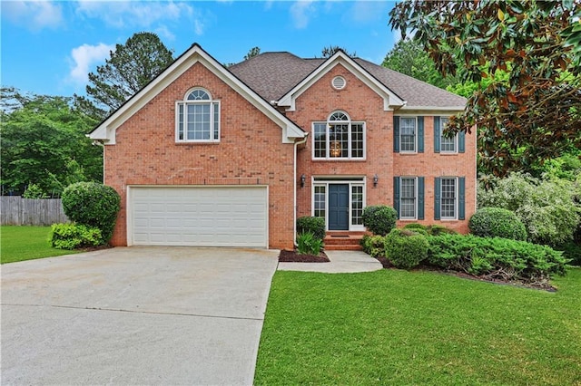 view of front of property with concrete driveway, brick siding, a front yard, and a garage