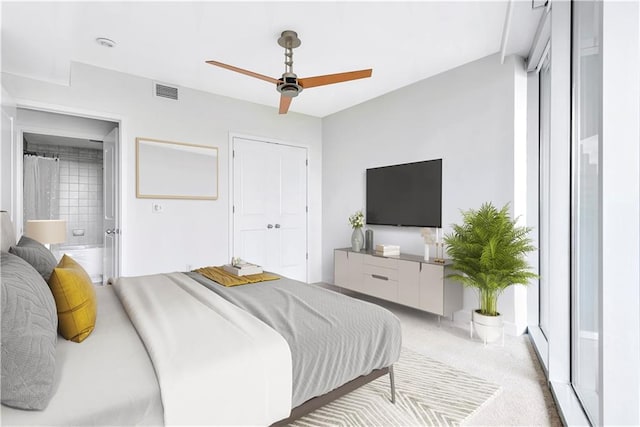 carpeted bedroom with ceiling fan