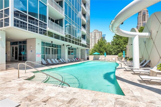 view of swimming pool with a patio area