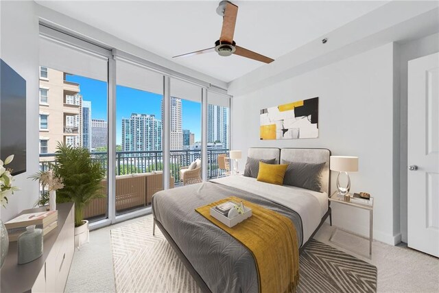 bedroom with ceiling fan, access to outside, and light carpet