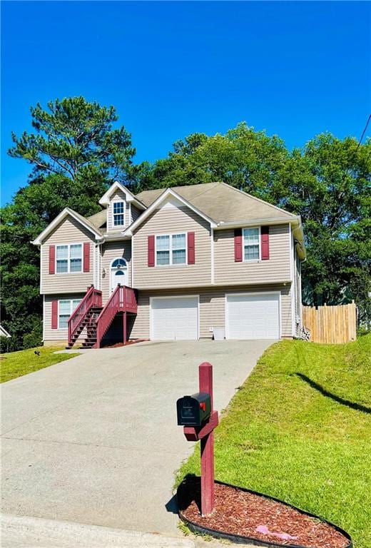 350 Fall View Ct, Winder, GA 30680 - split foyer home featuring an attached garage and concrete driveway
