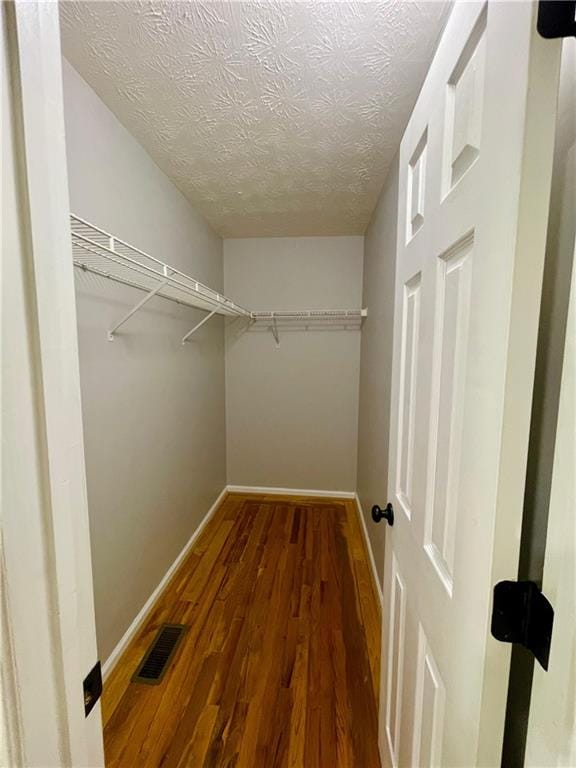 350 Fall View Ct, Winder, GA 30680 - spacious closet featuring wood finished floors