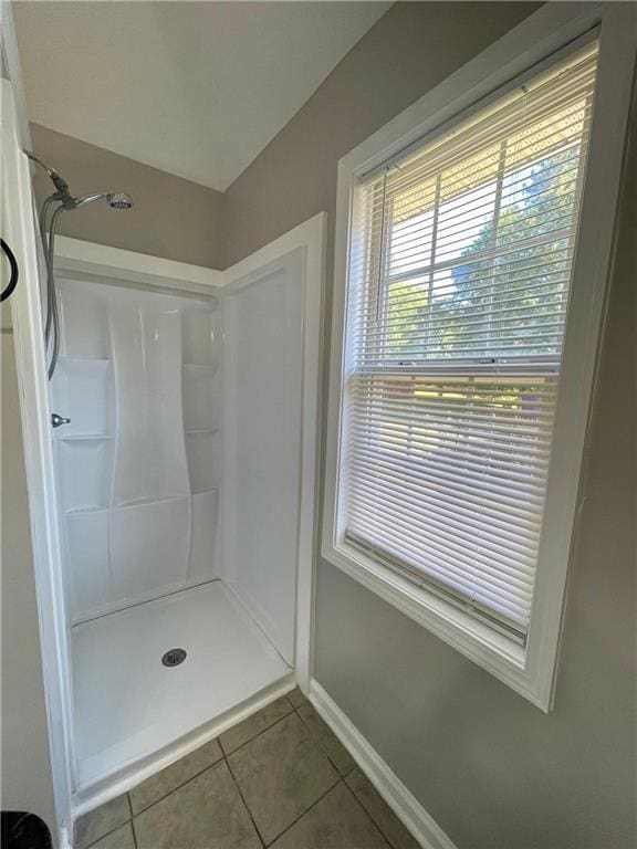 350 Fall View Ct, Winder, GA 30680 - bathroom featuring tile patterned flooring, a shower, and baseboards