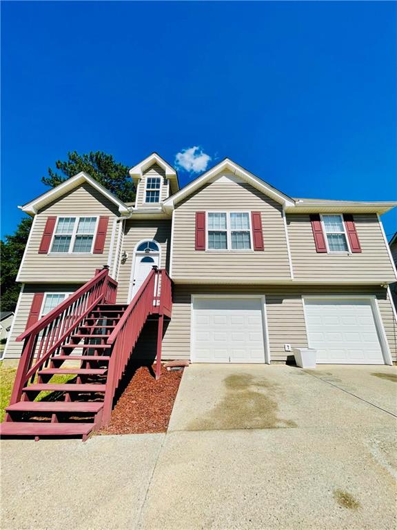 350 Fall View Ct, Winder, GA 30680 - raised ranch with an attached garage and driveway
