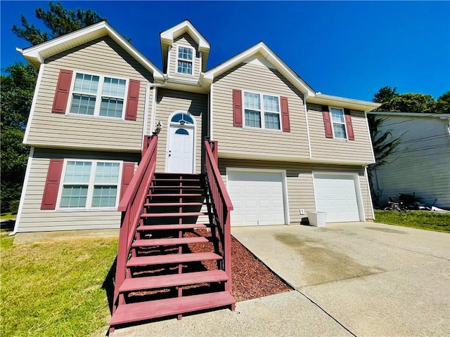 350 Fall View Ct, Winder, GA 30680 - raised ranch featuring an attached garage, driveway, and a front yard