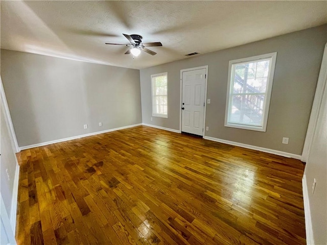 350 Fall View Ct, Winder, GA 30680 - foyer entrance featuring wood finished floors, healthy amount of natural light, ceiling fan, and baseboards
