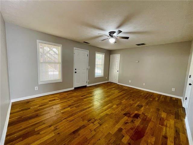 350 Fall View Ct, Winder, GA 30680 - foyer entrance featuring dark wood-style flooring, a ceiling fan, baseboards, and a textured ceiling