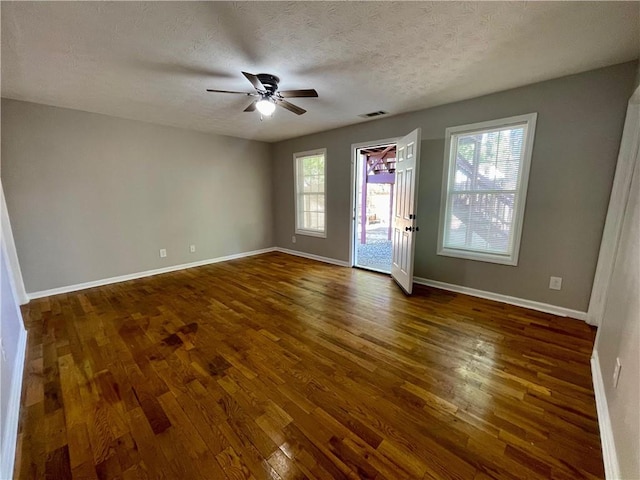 350 Fall View Ct, Winder, GA 30680 - spare room featuring dark wood-style floors, a ceiling fan, healthy amount of natural light, and a textured ceiling
