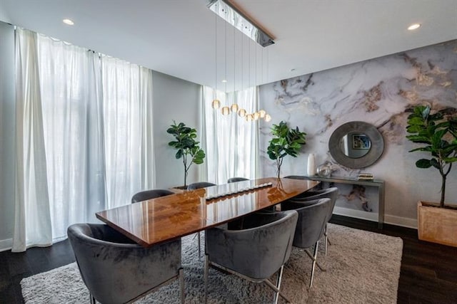 dining space with dark hardwood / wood-style flooring