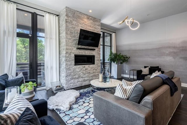 living room featuring a fireplace and dark hardwood / wood-style flooring