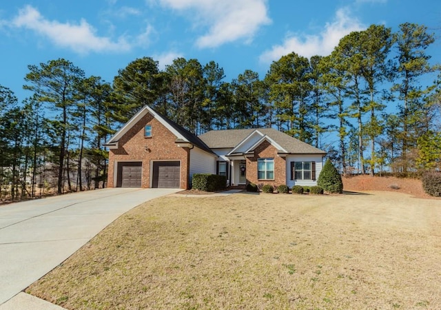 view of front of house with a garage and a front yard