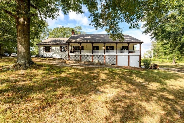 view of front of property with a front lawn and covered porch