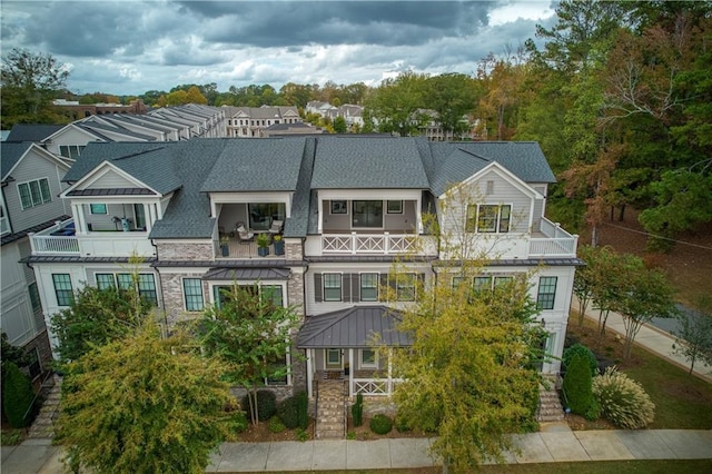 exterior space with a gazebo and a balcony