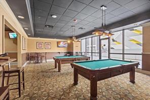 game room featuring carpet, pool table, and a drop ceiling