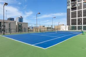 view of sport court with fence