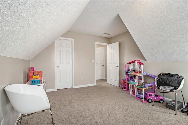 game room featuring lofted ceiling, carpet flooring, baseboards, and visible vents