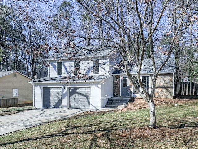 view of front property with central AC unit, a garage, and a front yard