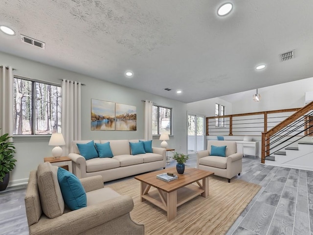 living room with a textured ceiling