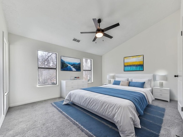 bedroom featuring carpet floors, vaulted ceiling, and ceiling fan