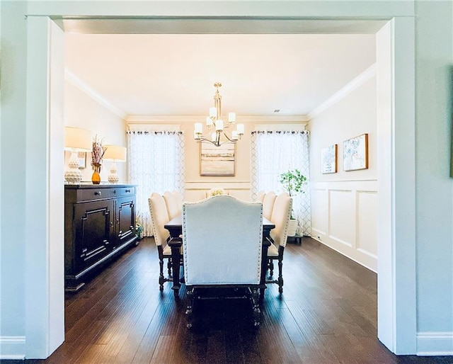 724 Laura Jean Ct, Buford, GA 30518 - dining area featuring ornamental molding, a chandelier, dark wood finished floors, and a decorative wall
