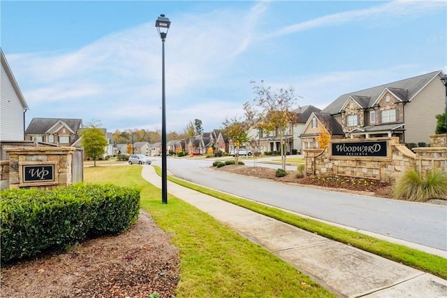 724 Laura Jean Ct, Buford, GA 30518 - view of asphalt road with a residential view, sidewalks, and street lighting