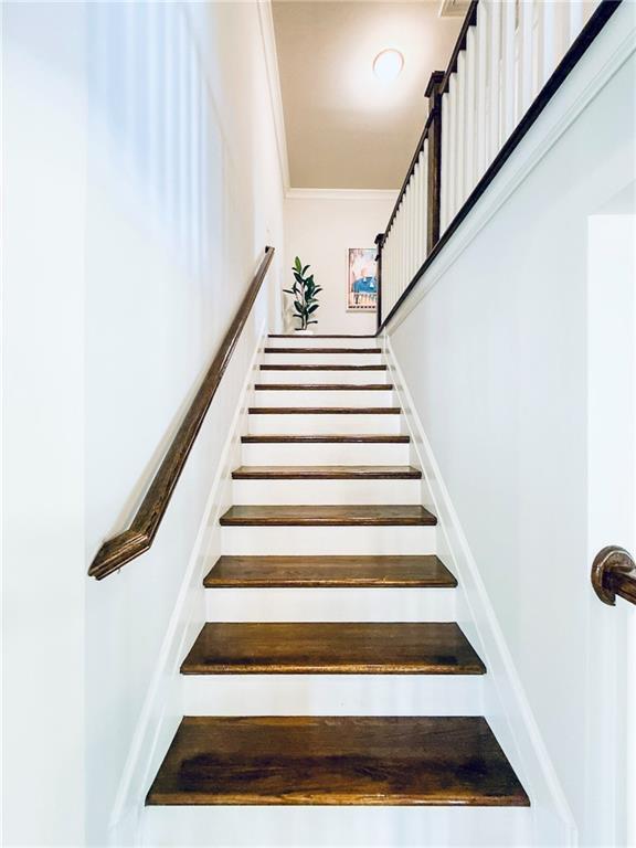 724 Laura Jean Ct, Buford, GA 30518 - staircase with crown molding