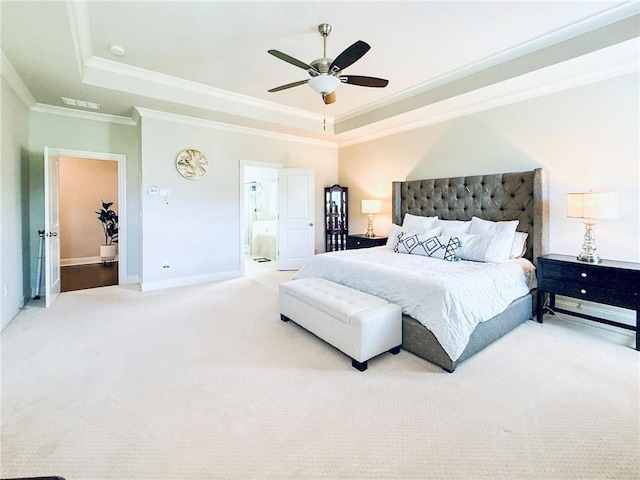 724 Laura Jean Ct, Buford, GA 30518 - carpeted bedroom featuring a raised ceiling, ornamental molding, baseboards, a ceiling fan, and ensuite bath