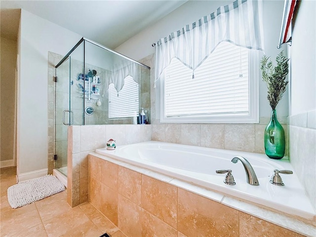 724 Laura Jean Ct, Buford, GA 30518 - bathroom featuring a garden tub, a shower stall, tile patterned floors, and healthy amount of natural light