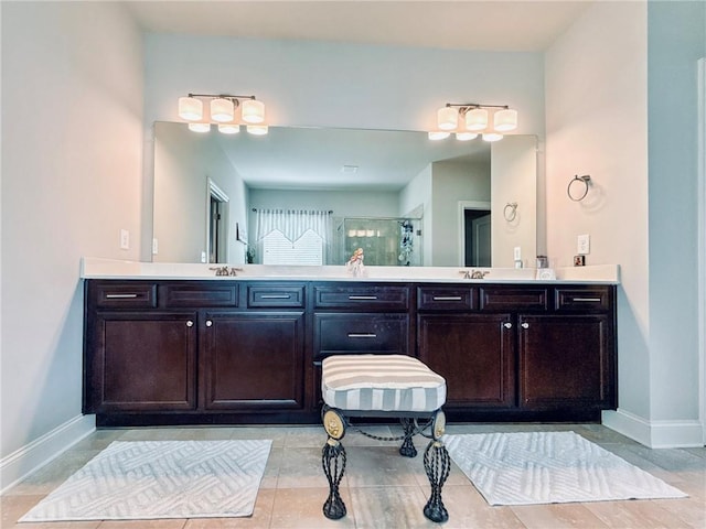 724 Laura Jean Ct, Buford, GA 30518 - full bathroom with double vanity, baseboards, and a stall shower