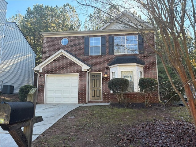 view of front of house featuring central AC and a garage