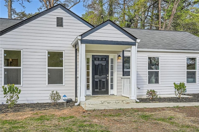 view of front of property with roof with shingles