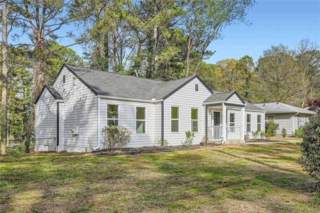 view of front of house with a shingled roof