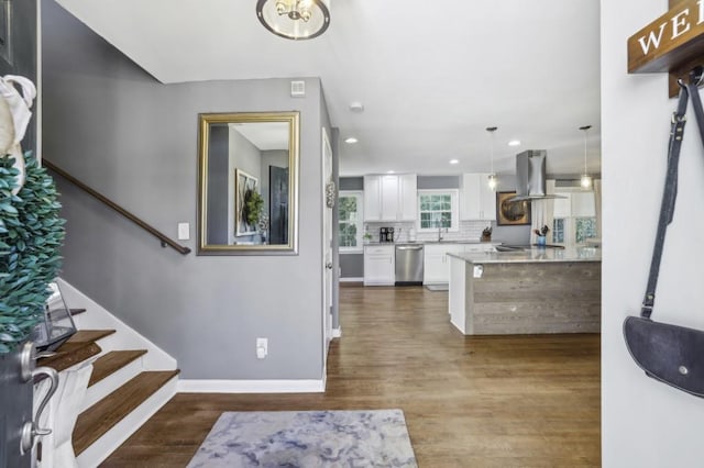 entryway featuring stairs, baseboards, dark wood-type flooring, and recessed lighting