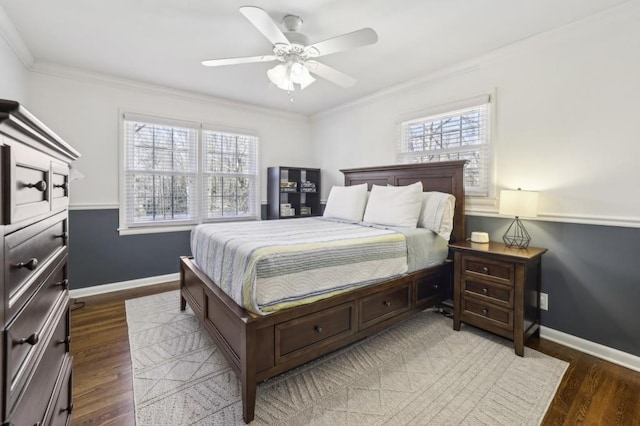 bedroom featuring ornamental molding, ceiling fan, baseboards, and wood finished floors