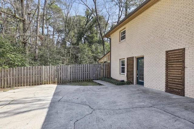 view of patio featuring fence