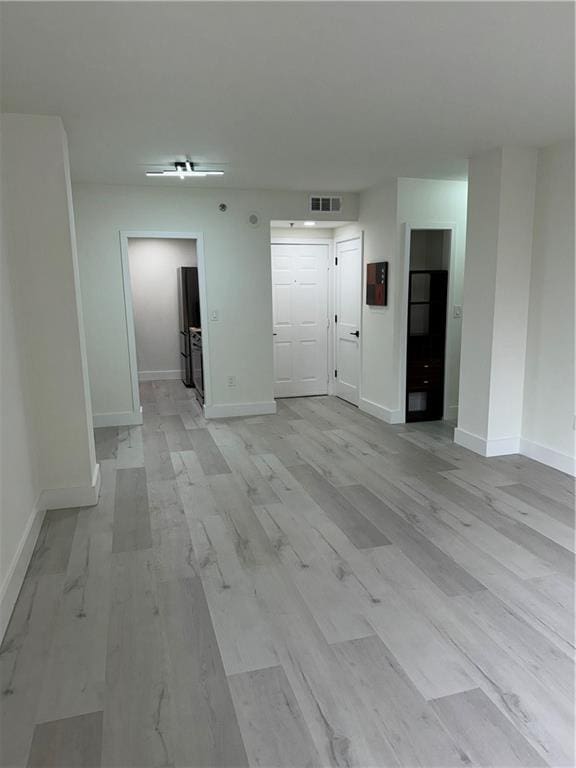 empty room featuring light hardwood / wood-style floors