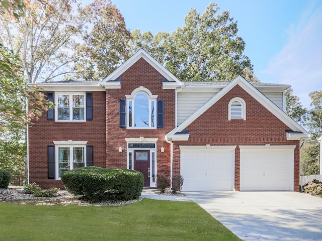 view of front of house featuring a garage and a front yard