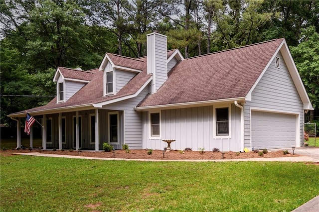 cape cod house with a chimney, board and batten siding, a front yard, and concrete driveway