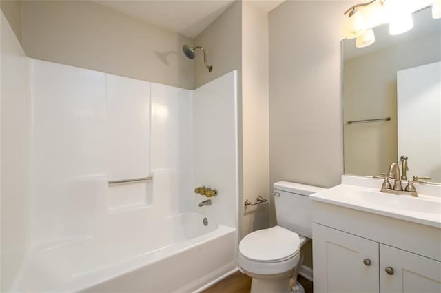 bathroom featuring toilet,  shower combination, and vanity