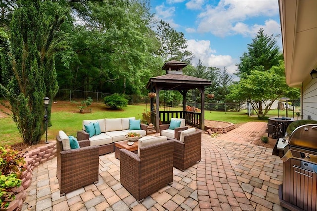 view of patio / terrace with a gazebo, an outdoor living space, and area for grilling