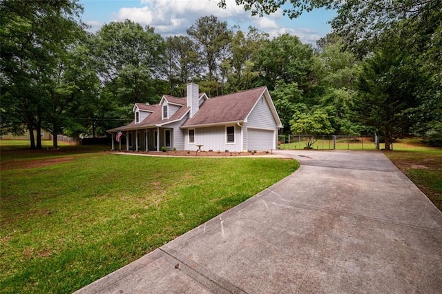 cape cod house featuring driveway, a chimney, and view of scattered trees