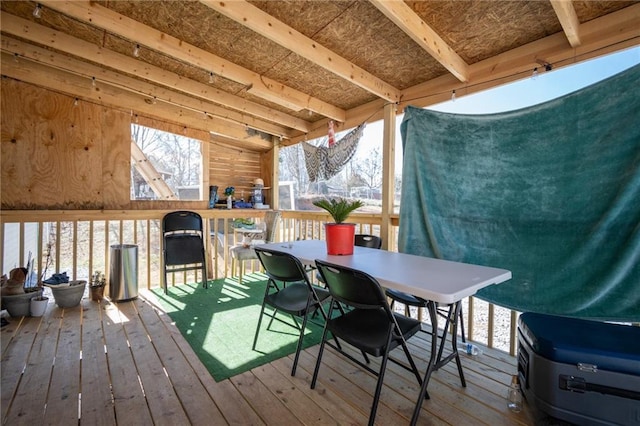 wooden terrace with outdoor dining space