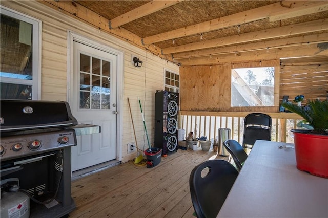 wooden terrace featuring a grill