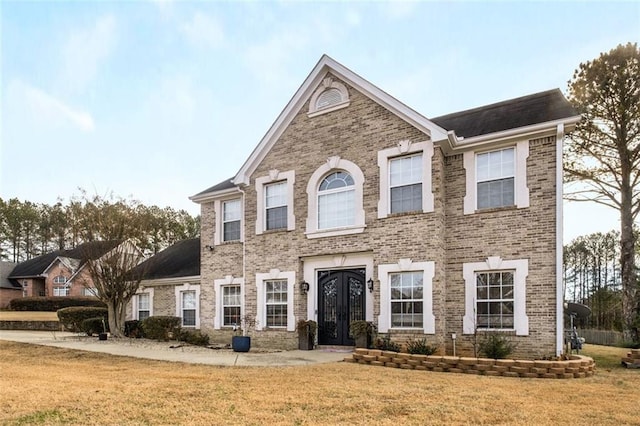 view of front facade with a front lawn