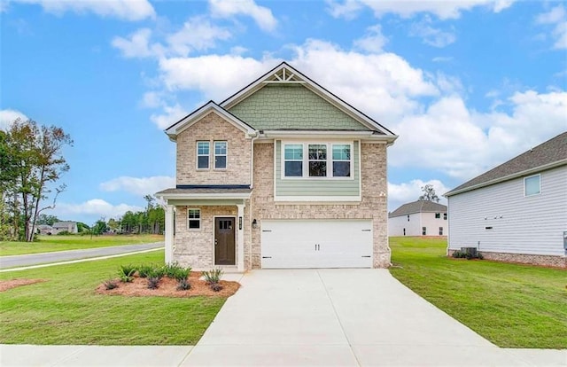 craftsman house with a front yard and a garage