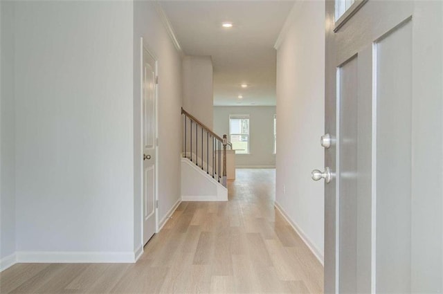 corridor with light wood-type flooring