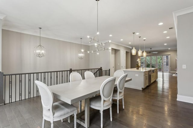 dining room featuring recessed lighting, dark wood-style flooring, ornamental molding, ceiling fan with notable chandelier, and baseboards